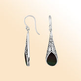 Silver teardrop earrings featuring Black Shell and ornate Bali scroll patterns.